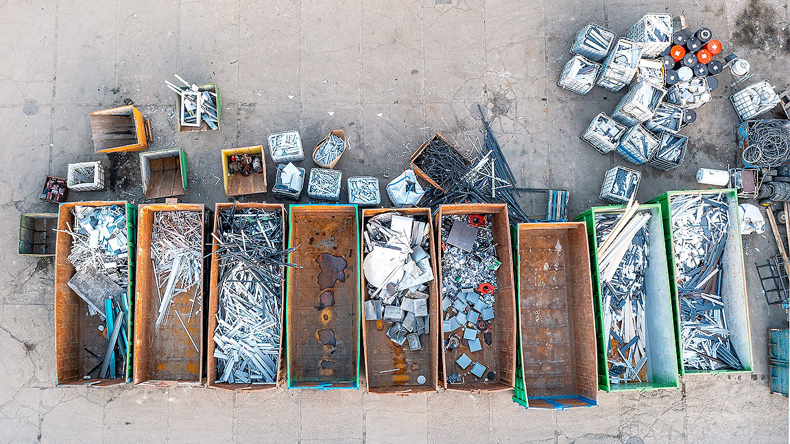 Overhead picture of building materials being sorted into skips for recycling