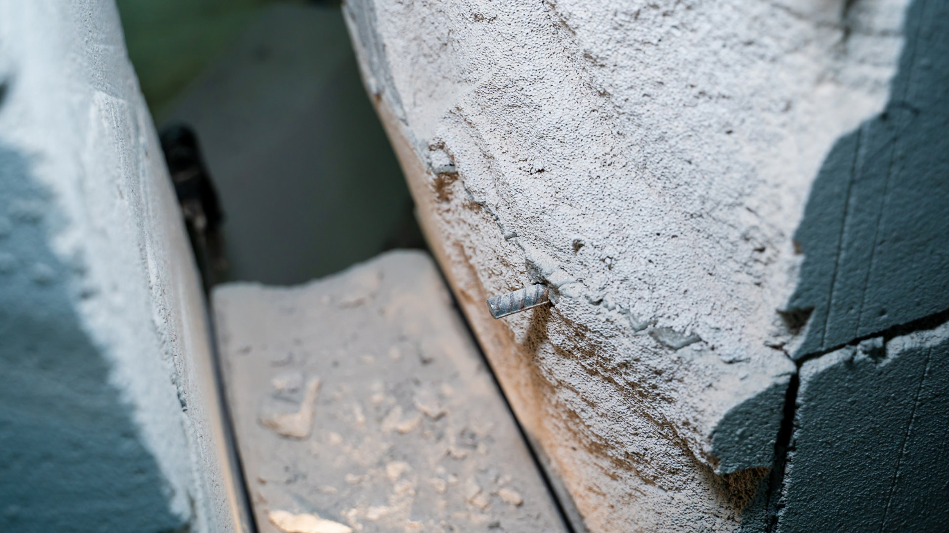 A close-up of RAAC showing the bubble-like texture and steel reinforcement