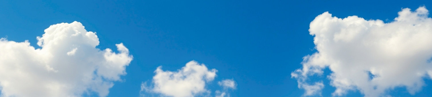 White clouds in a blue sky.