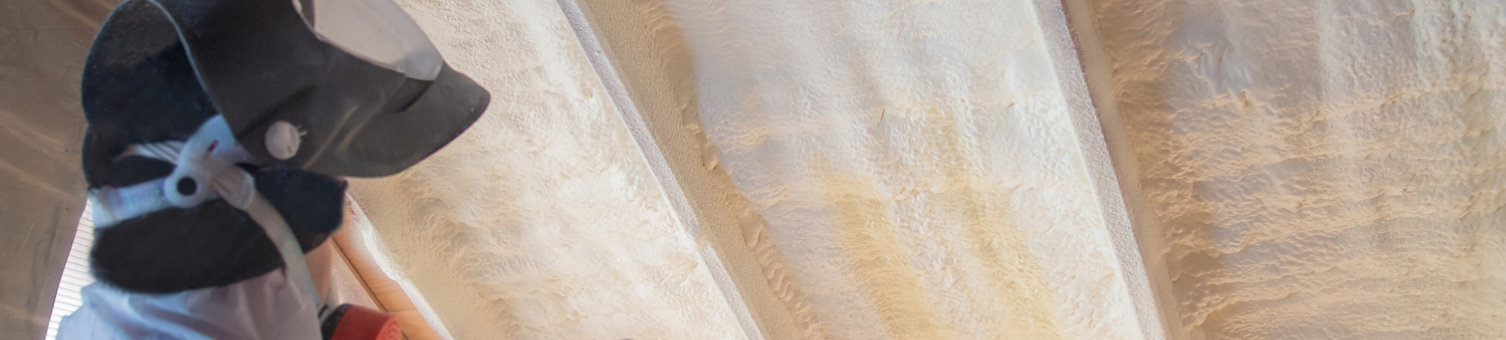 Spray foam insulation being applied to a roof