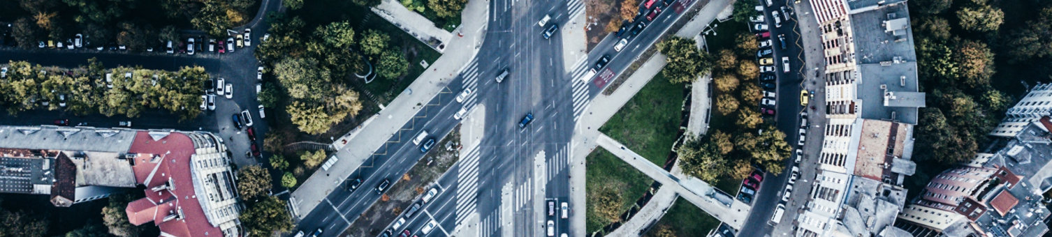 aerial view of large motorway intersection in built environment