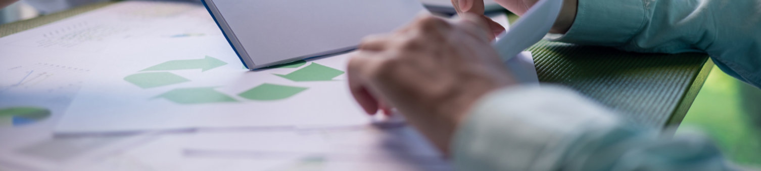 two people working together studying data