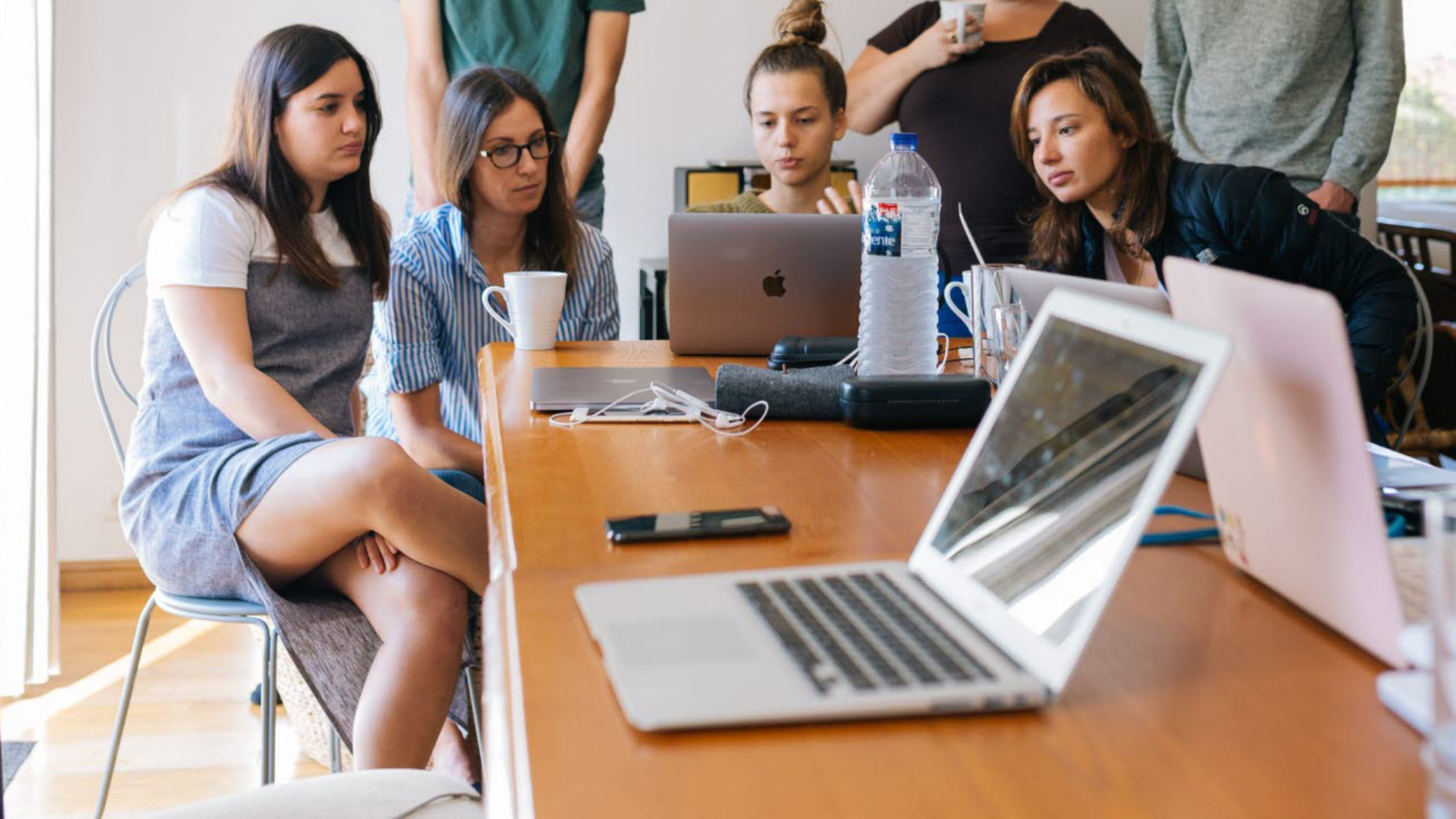 women sat together working