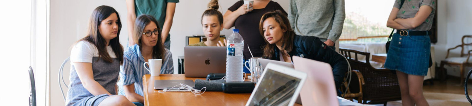 women sat together working