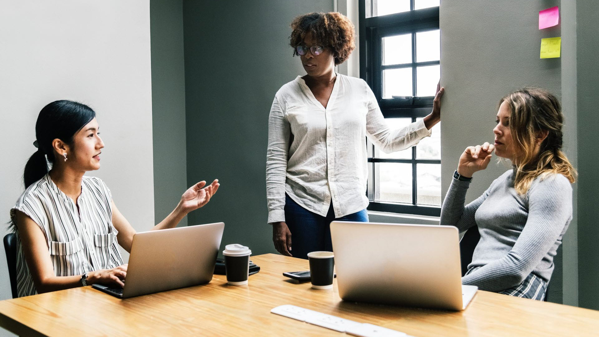 women sat together working