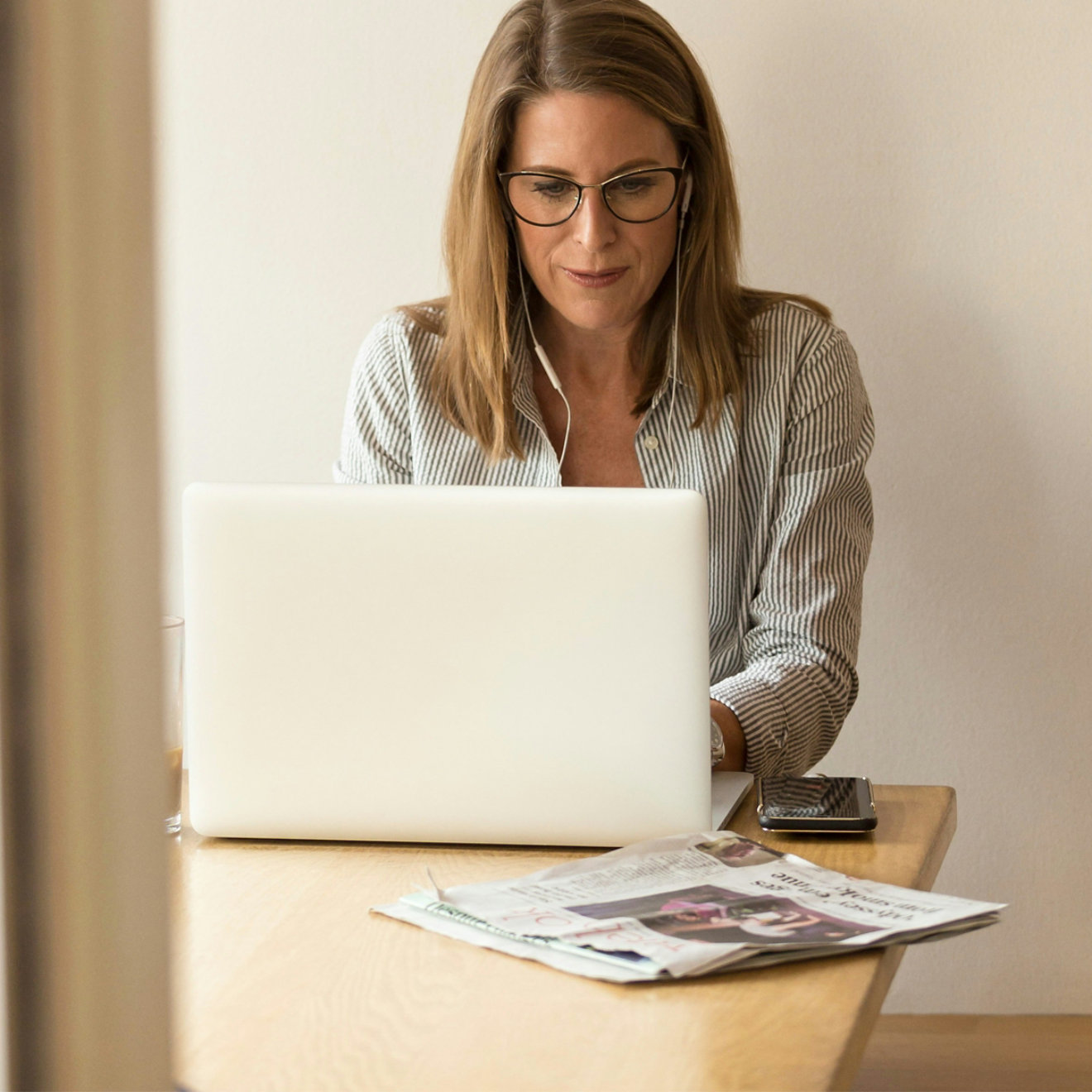 A woman looking at a laptop