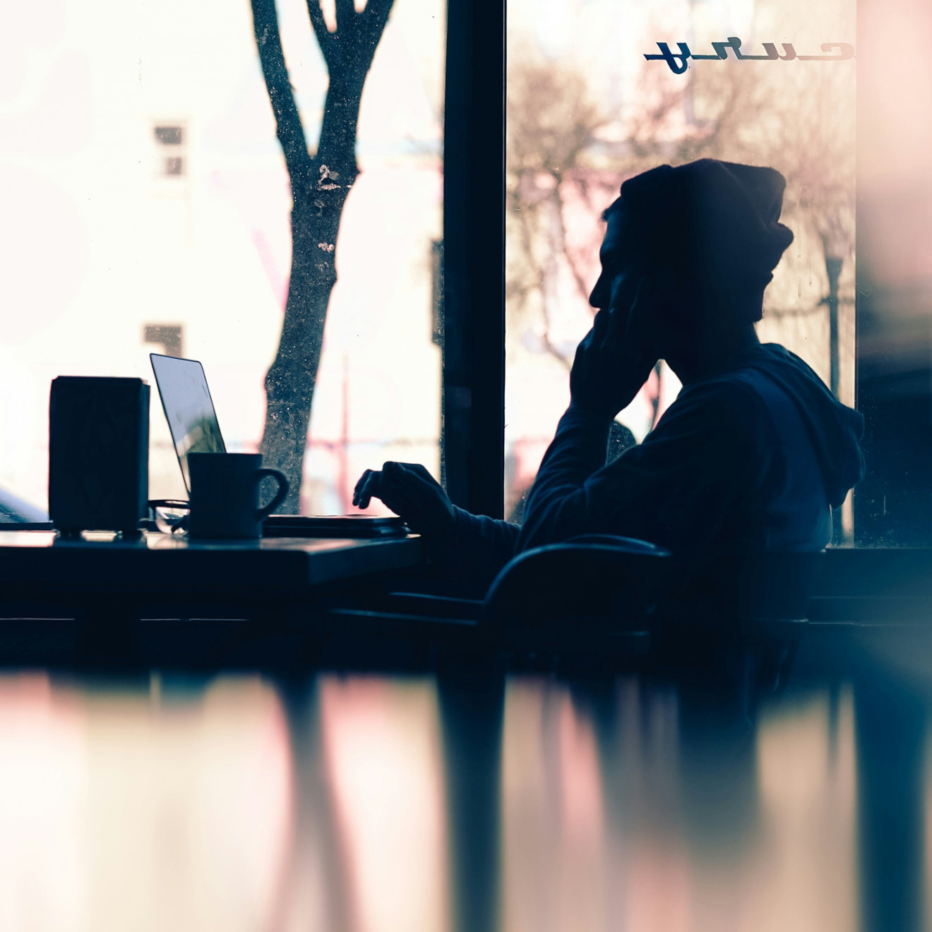 A man looking at a laptop