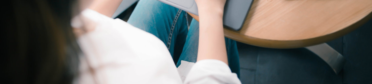 Person working on a laptop sat down