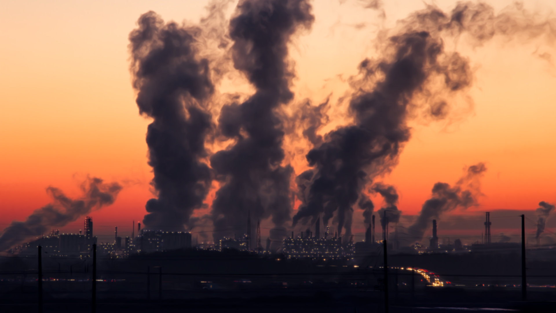 Smoke coming out of factory chimneys