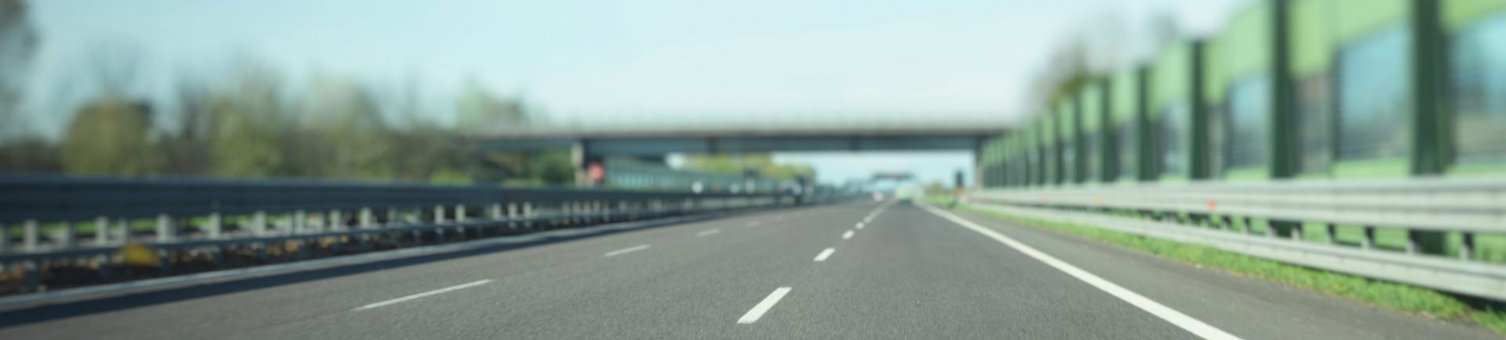 gray-asphalt-road-under-blue-sky.jpg